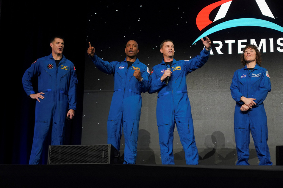 Glover (2nd from l.) will be the first person of color to fly around the moon, while Koch (r.) and Hansen (3rd from l.) will be the first woman and Canadian, respectively.