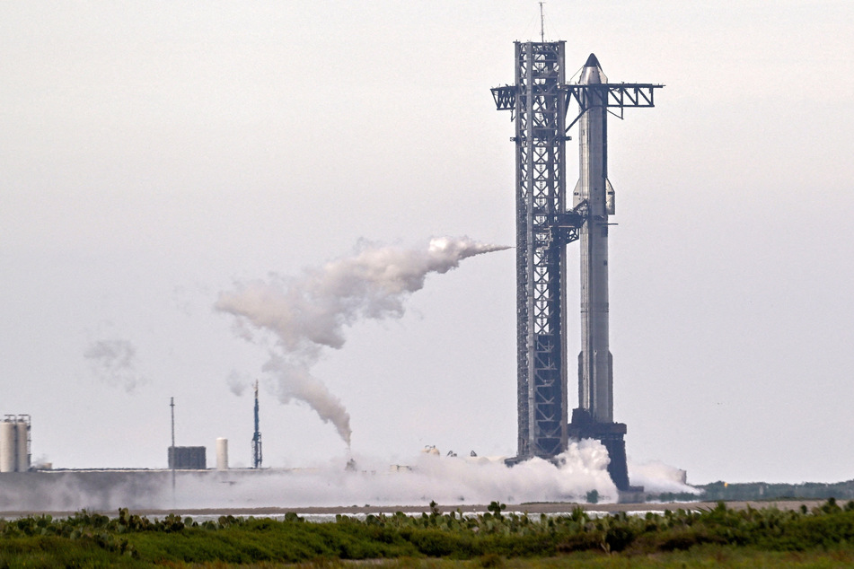 A SpaceX Super Heavy booster carrying the Starship spacecraft vents before the launch is scrubbed at the company's launch complex in Texas on August 24, 2025.