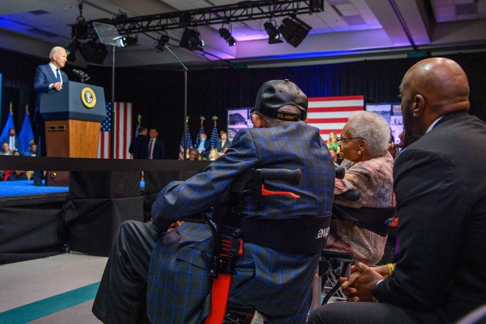 Hughes Van Ellis, Viola Ford Fletcher, and Damario Solomon-Simmons listen as President Joe Biden delivers remarks on the anniversary of the Tulsa Race Massacre.