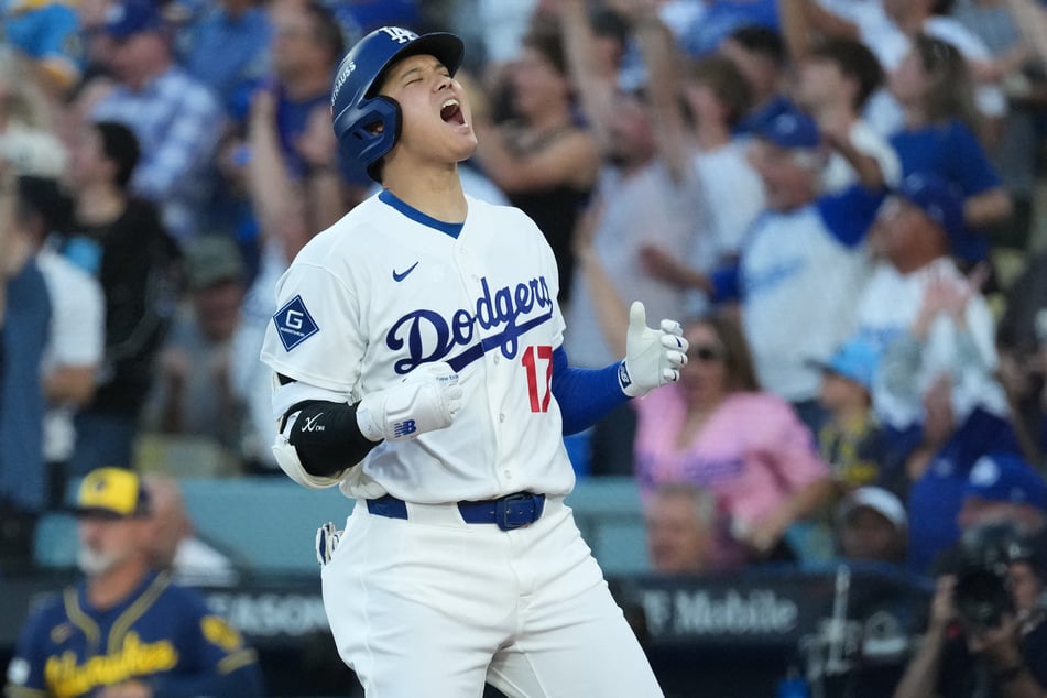 Los Angeles Dodgers designated hitter Shohei Ohtani reacts after hitting a three-run home run during the second inning against the Milwaukee Brewers in game four of the NLCS. The Japanese superstar is reportedly not going to get surgery in the off-season after suffering multiple injuries.