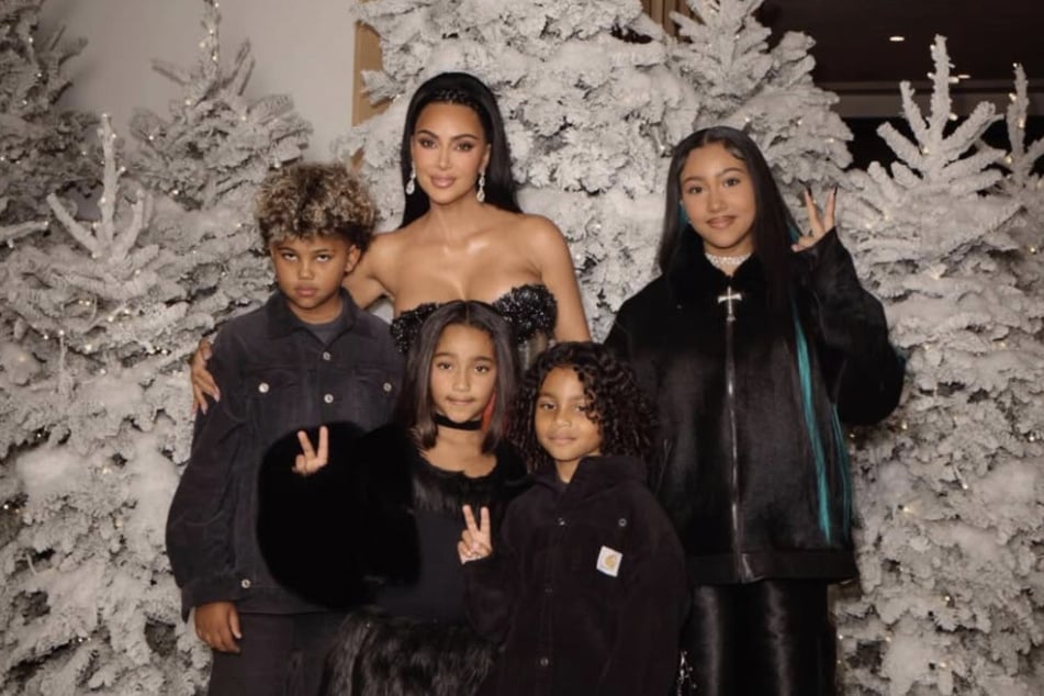 Kim admitted that she has "fears" over raising kids in the spotlight and does hold her eldest daughter, North (r), back from certain projects.