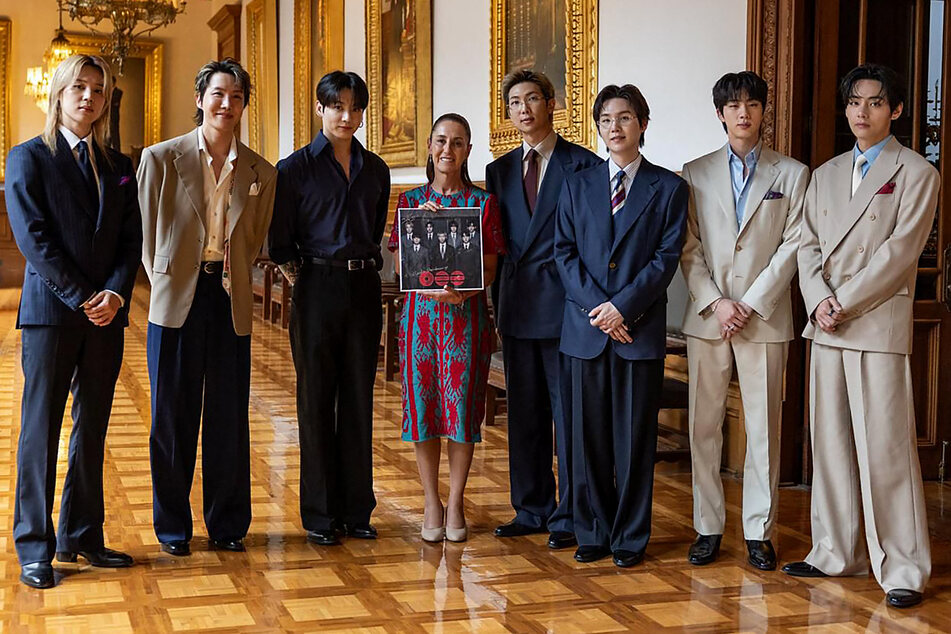 Mexico’s President Claudia Sheinbaum poses with BTS at the Palacio Nacional in Mexico City on May 6, 2026.