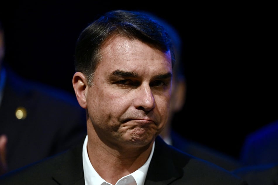 Brazil's right-wing presidential candidate Flavio Bolsonaro attends a press conference in Brasilia on August 5, 2026. He fled the country after his election loss.