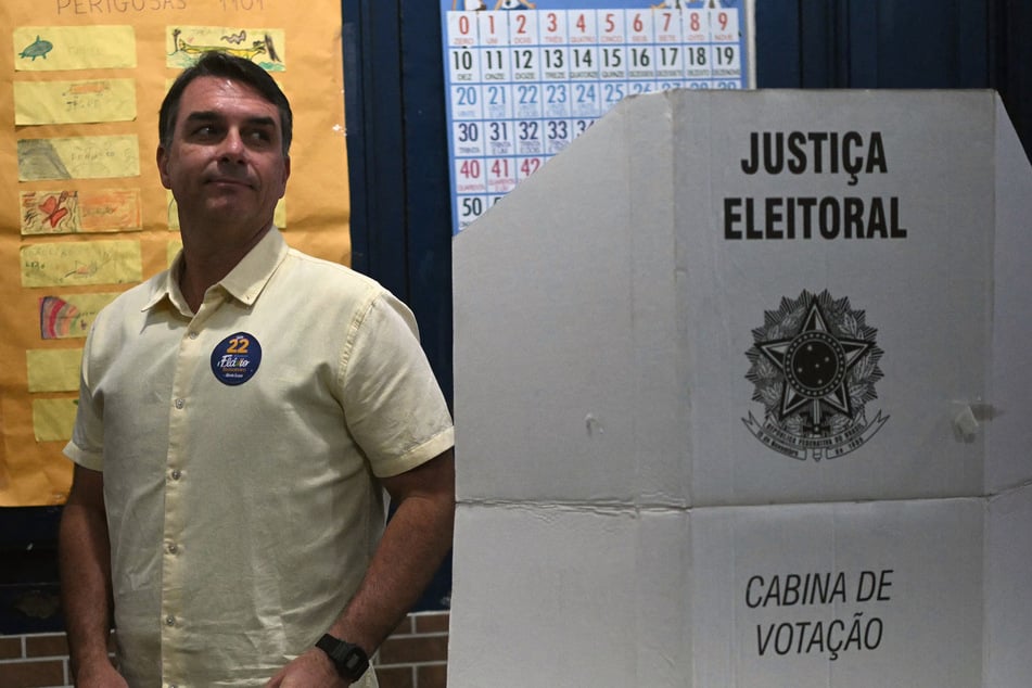 Flavio Bolsonaro exits a voting booth after casting his ballot during the presidential runoff election in Rio de Janeiro, Brazil, on October 25.