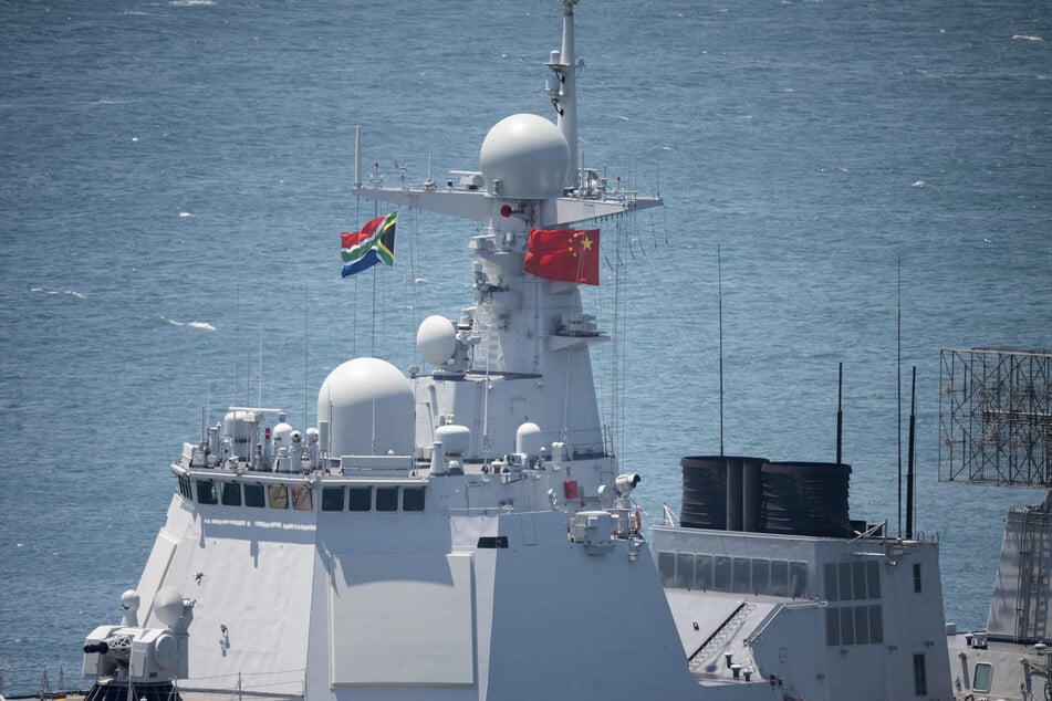 The Chinese and South African flags fly atop China's Tangshan guided-missile destroyer in Simon's Town Harbor, near Cape Town.