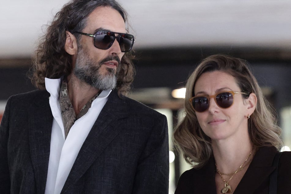 Russell Brand and his wife Laura (r.) leave after jury selection finishes at the start of his trial at Southwark Crown Court on Monday. The comedian has found a new following online as a right-wing influencer.