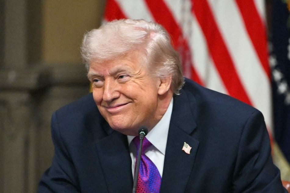 President Donald Trump smiles during a roundtable on Ratepayer Protection Pledge on March 4, 2026. His administration recently rolled out a new "Love Me" ad campaign ahead of the midterms that was "Paid for by the US Government."