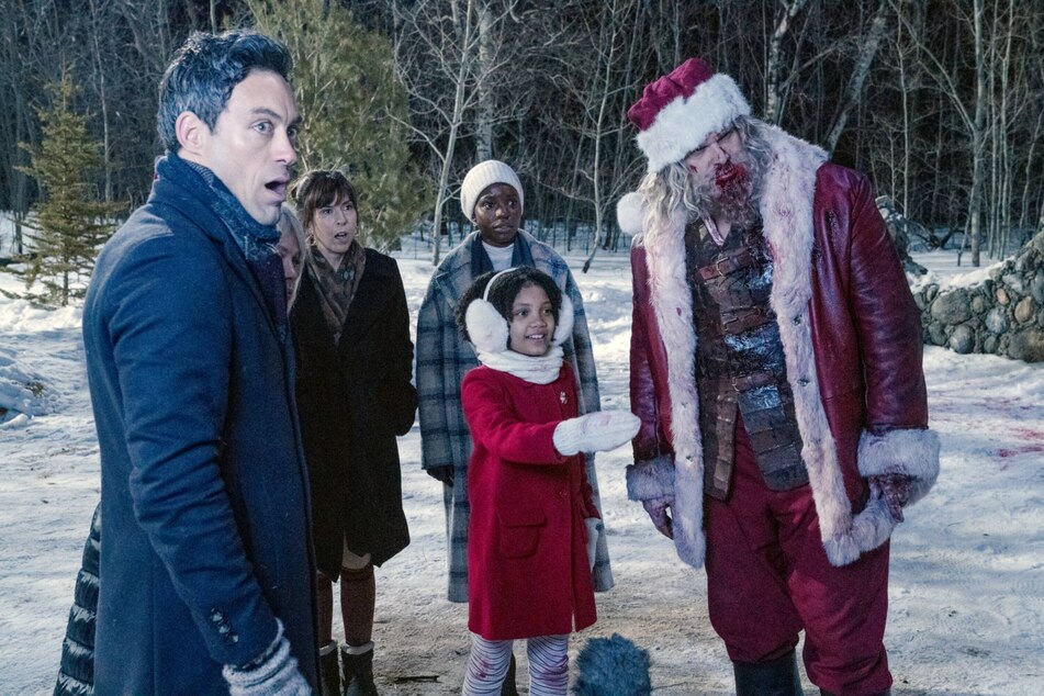 David Harbour (r) takes on the role of Santa Claus with a twist in the action-comedy, Violent Night.