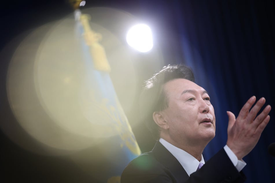 South Korea's Yoon Suk Yeol answers a reporter's question during a press conference at the Presidential Office in Seoul on November 7, 2024.