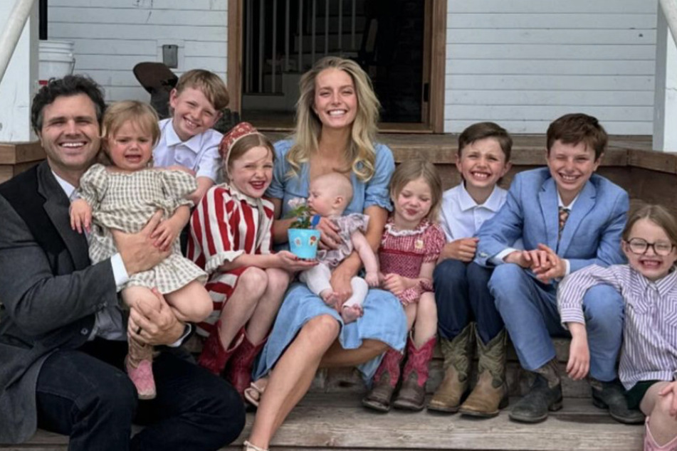 Daniel and Hannah Neeleman seen smiling along with their eight children.
