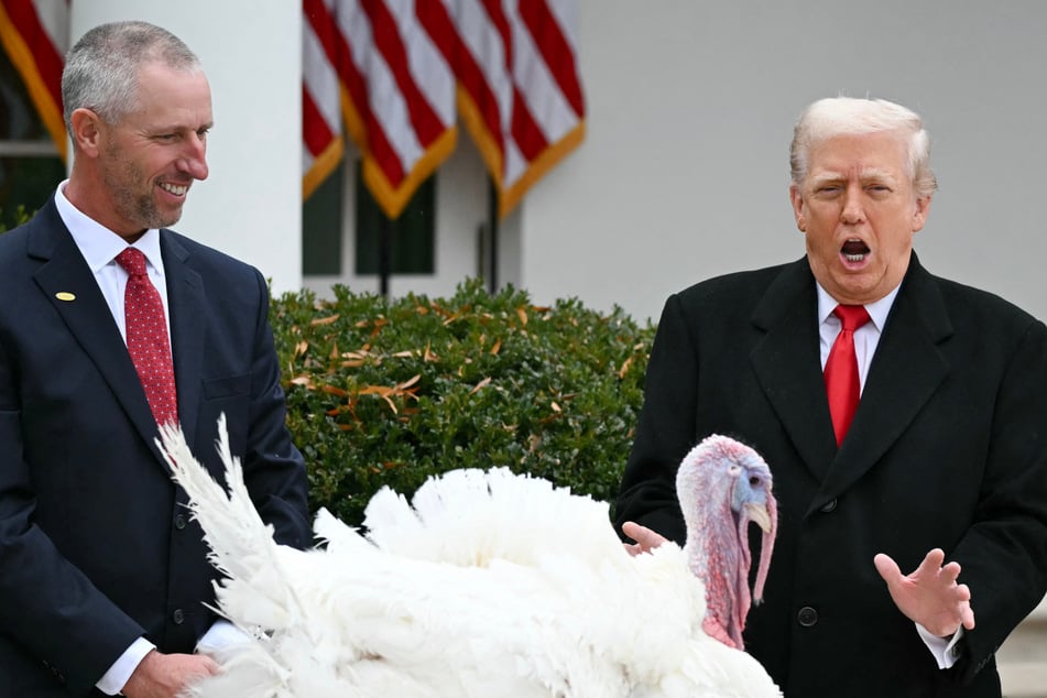 President Trump (r.) couldn't resist taking a few jabs at his political enemies as he took part in Washington's annual turkey pardoning ahead of Thanksgiving.