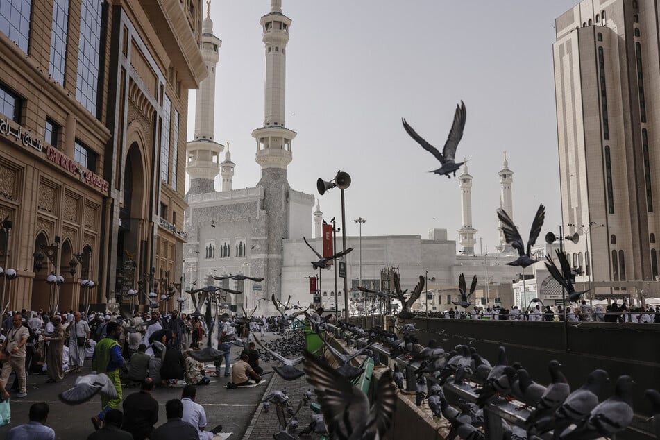 Muslim worshippers leave the Grand Mosque complex after offering prayers in the holy city of Mecca on May 24, 2026.