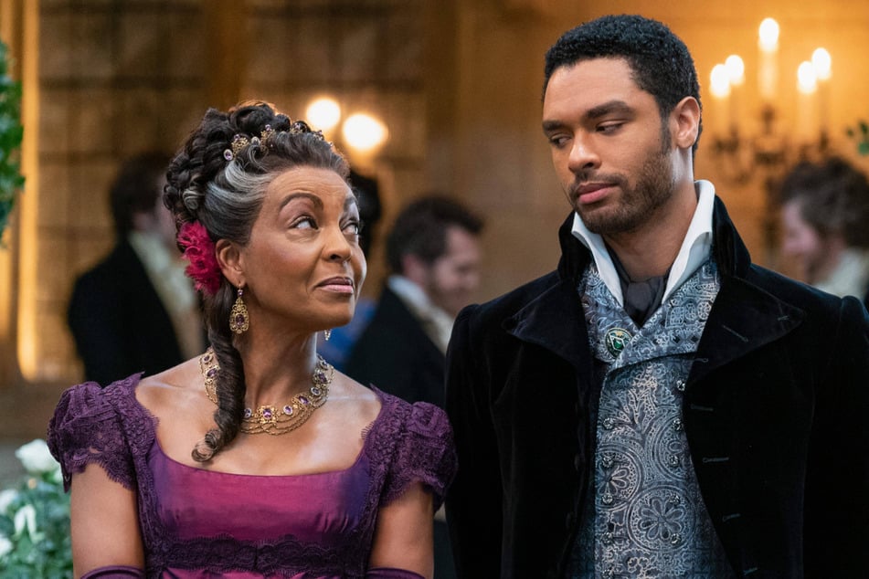 Adjoa Andoh (l.) played the regal Lady Danbury, and shared ample screen time with Rege-Jean Page (r.) as Simon Basset.