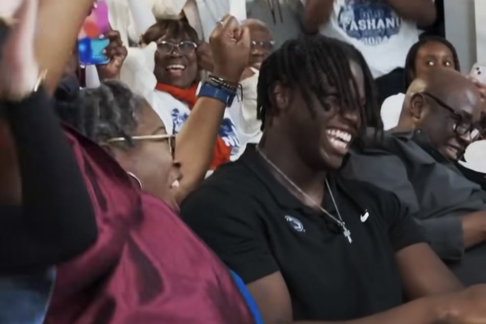 This NFL Draft season captured an instant classic with another "mom vs. girlfriend" battle taking the spotlight with former Penn State's Olu Fashanu (center r.).
