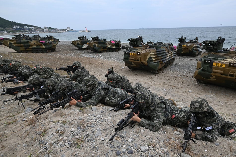 South Korean marines take positions on a beach during the Ssangyong joint landing operation with the US in Pohang on September 2, 2024.