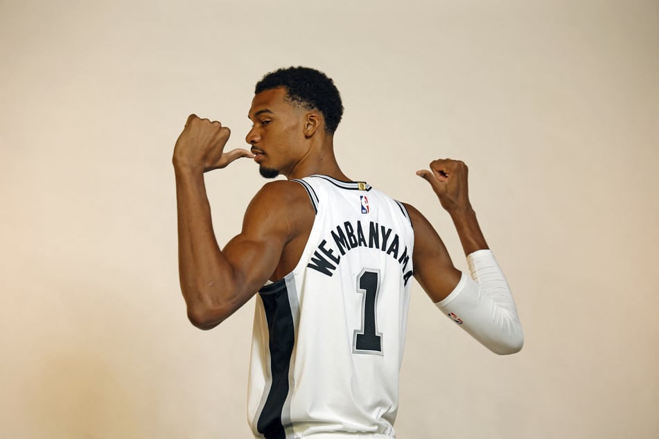 Victor Wembanyama poses for photos during San Antonio Spurs Media Day on September 28, 2026, in San Antonio, Texas. The Spurs star player said he "will never" get in on the sports betting cash flow. 