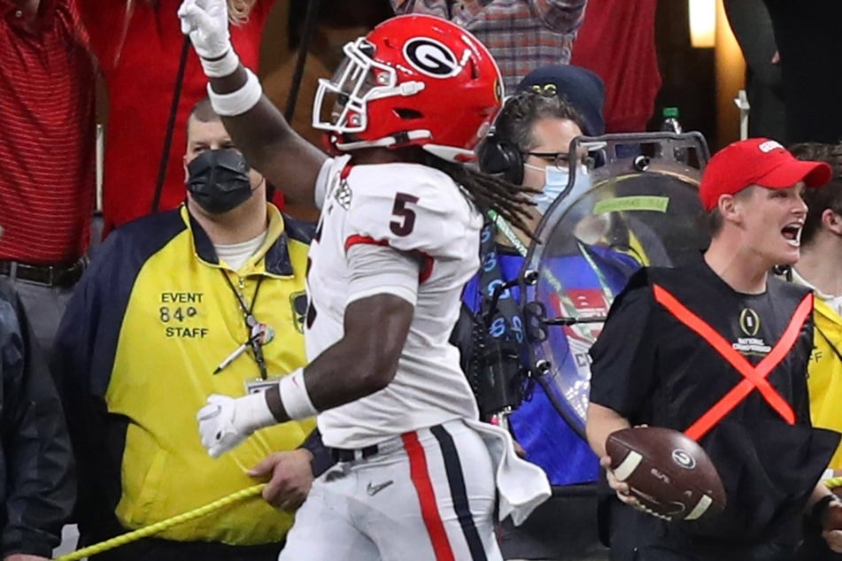 Defensive back Kelee Ringo (5) celebrates his 79-yard pick-six that sealed the win for Georgia.