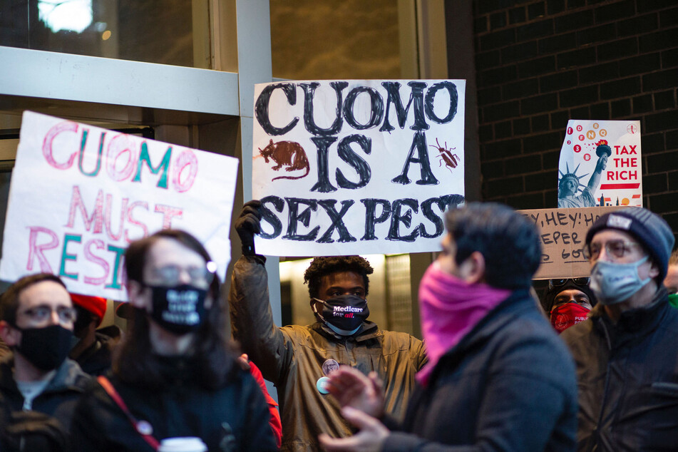 People attend a protest to demand New York Governor Andrew Cuomo's resignation after a third woman accused him of sexual harassment in New York City on March 2, 2021.
