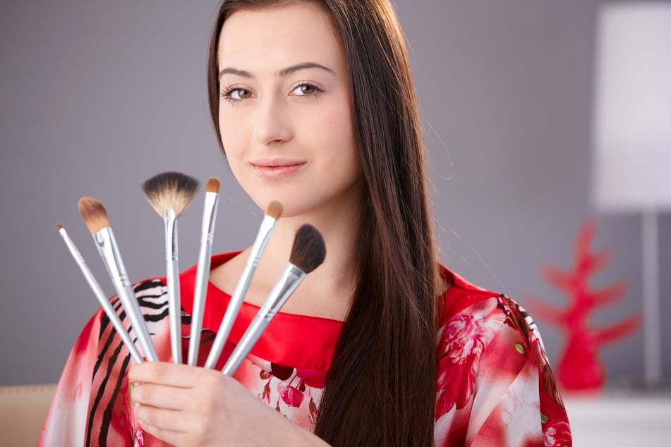 Applying makeup with brushes is one way to reduce the chance of accidentally staining your clothes with excess product.