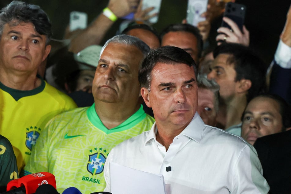 Brazilian presidential candidate Flavio Bolsonaro arrives to speak after losing the presidential runoff election in Brasilia on October 25, 2026.