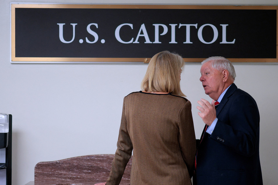 Sen. Lisa Murkowski (l.) was pulled aside by Sen. Lindsey Graham before the vote on a Venezuela war powers resolution on Wednesday.
