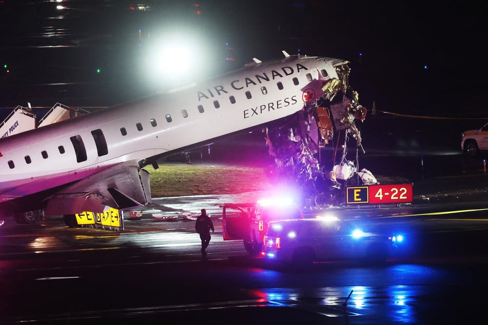 An Air Canada Express plane sits on the tarmac after it collided with a fire truck on the tarmac at LaGuardia Airport on March 23, 2026, in New York City.
