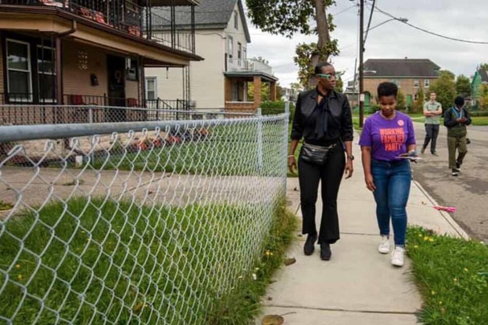 Nina Turner (l.) and India Walton went door to door speaking with voters about Walton's mayoral campaign.
