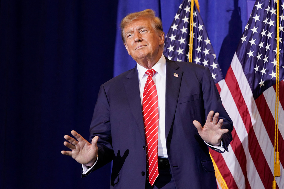 Former president and 2024 Republican frontrunner Donald Trump gestures during a rally ahead of the New Hampshire primary election in Concord on January 19, 2024.
