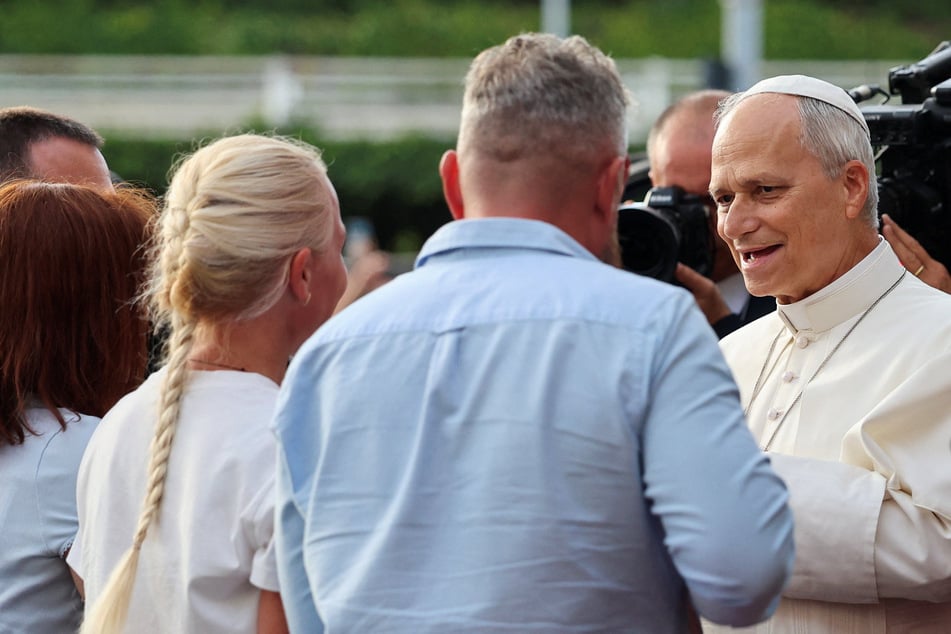Pope Leo speaks to a Ukrainian family whose daughter is undergoing cancer treatment, as he leaves Gemelli hospital following lung surgery and cancer diagnosis, in Rome, Italy, on October 17, 2026.