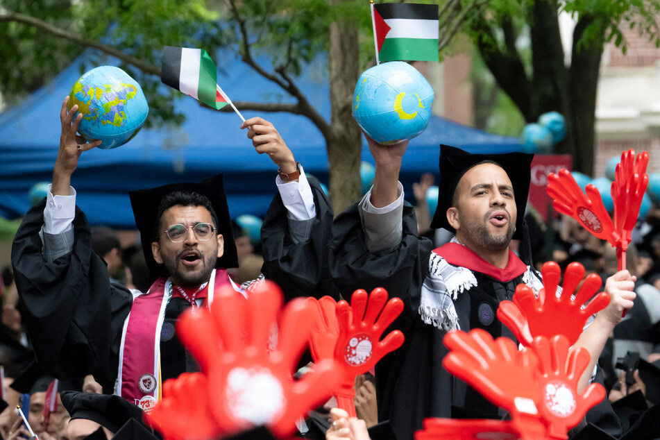 Many students from the Harvard Kennedy School of Government carried inflatable plastic globes at the ceremony to symbolize the international makeup of the school's student body.