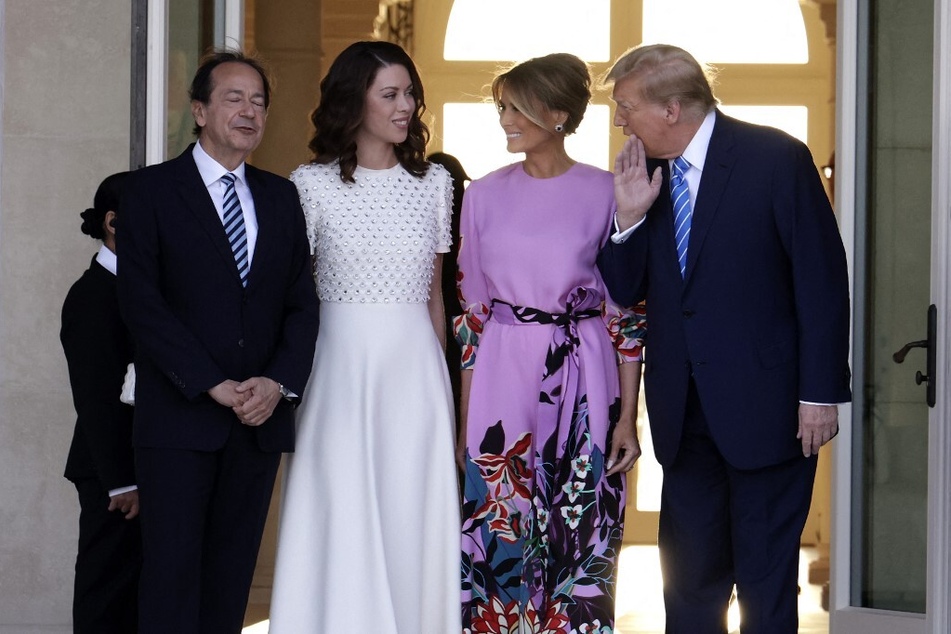 Donald Trump (r.) and his wife Melania Trump (2nd from r.) arrive at the home of John Paulson and Alina de Almeida in Palm Beach, Florida.