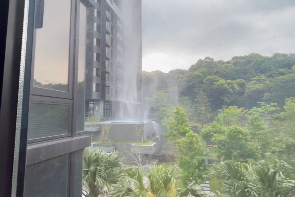 Debris falls from a building during an earthquake just off the eastern coast of Taiwan.
