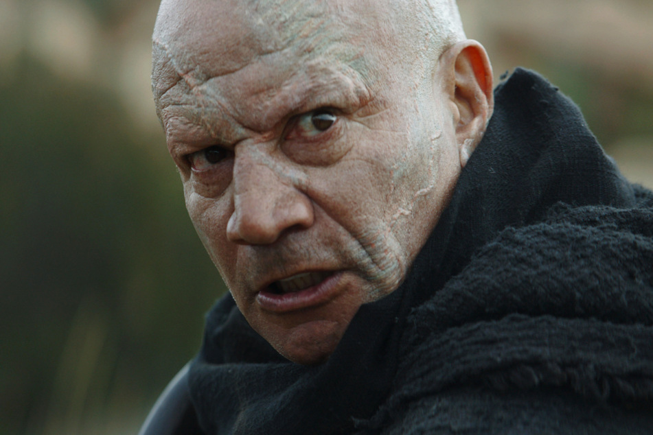 Boba Fett (Temuera Morrison, 60) is recognizably scarred from his life as a bounty hunter.