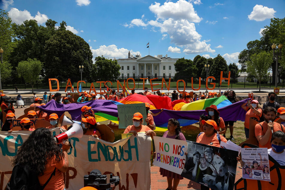 Activists associated with the United We Dream organization gather near the White House on June 15, the ninth anniversary of the Obama administration signing the Deferred Action for Childhood Arrivals policy.