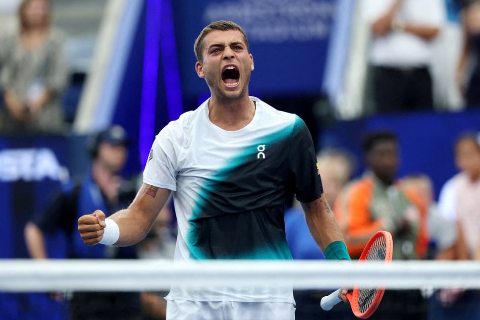 Italy's Flavio Cobolli celebrates after winning his US Open first round match against Argentina's Francisco Comesana (not pictured).