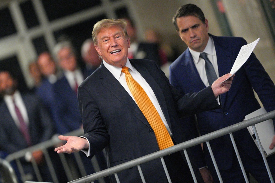 Donald Trump, with attorney Todd Blanche, speaking to the media during his hush money trial at Manhattan Criminal Court in New York City on May 21, 2024.