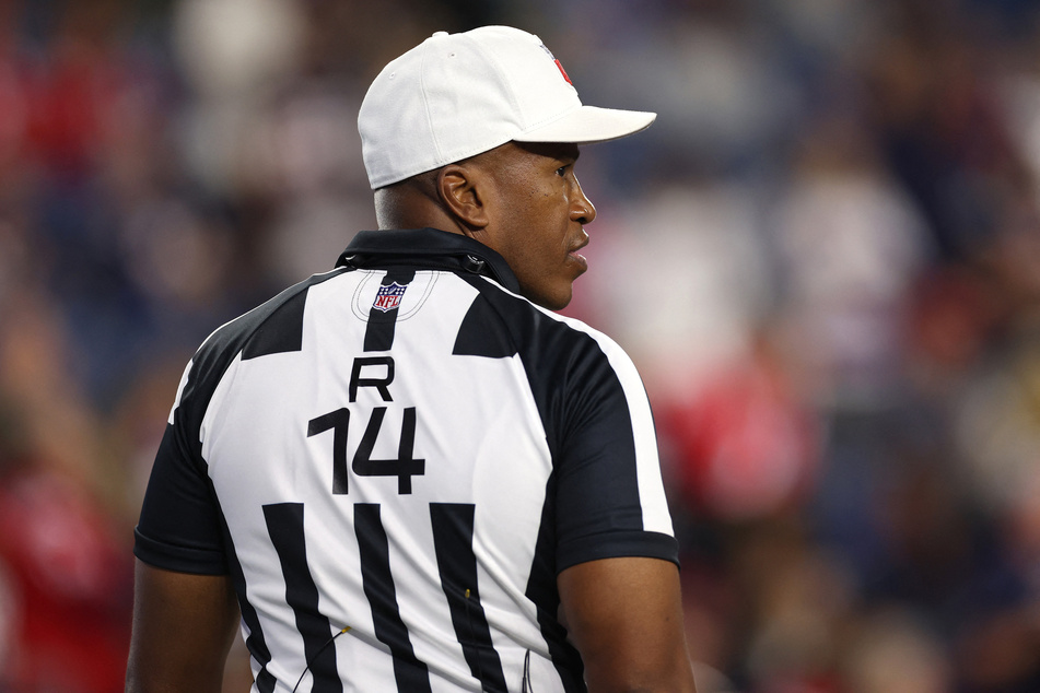NFL official Shawn Smith works as a manager at the Detroit branch of a medical insurance firm.