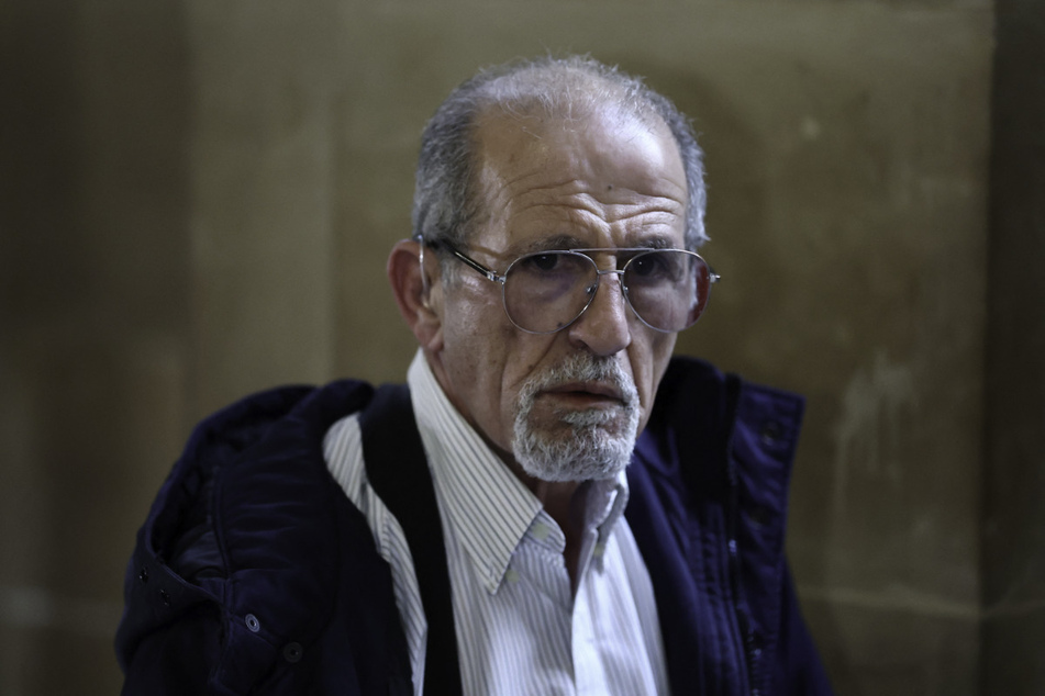Aomar Ait Khedache is pictured during a break on the first day of his Kim Kardashian robbery trial at the Court of Appeal of Paris, France.