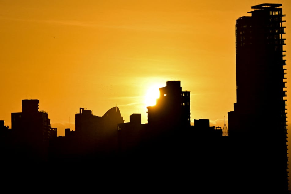 The sun rises over the city skyline in Panama City on August 11. Researchers warn that this year's powerful El Niño could result in hundreds of thousands of additional heat-related deaths.