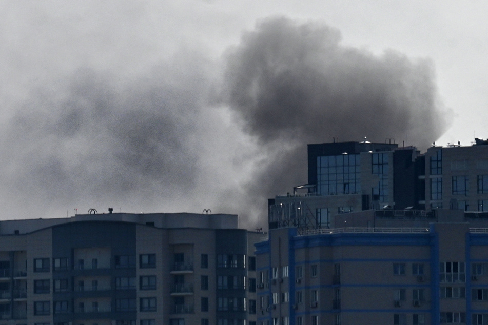 Smoke rises over buildings following a Russian drone attack in Kyiv, on Monday amid the Russian invasion of Ukraine.