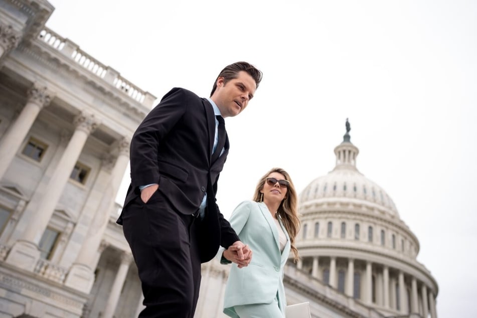 Matt Gaetz and his wife Ginger Luckey walk down the steps of the House of Representatives on Capitol Hill on April 19, 2024 in Washington, DC.
