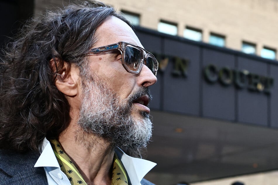 Russell Brand leaves Southwark Crown Court in London on October 19. The comedian has denied all of the charges against him.