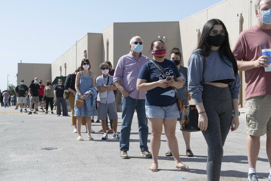 Millions around the US cast early ballots in potentially record-breaking election