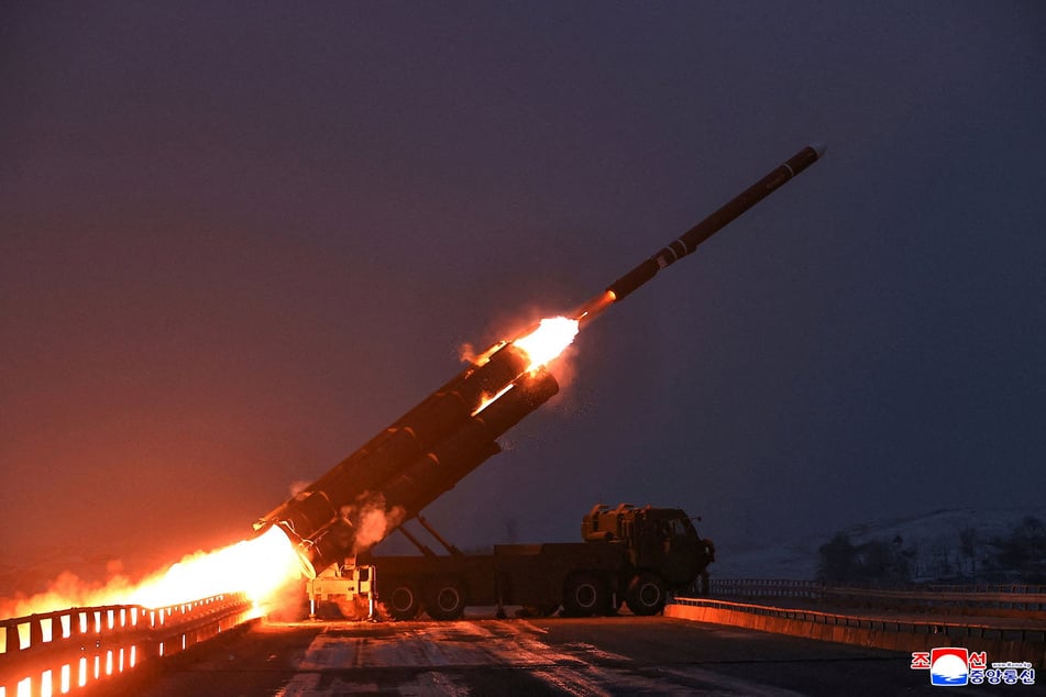 North Korean leader Kim Jong-un supervised the test launch of two long-range cruise missiles on Sunday.