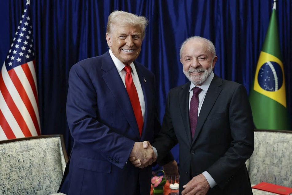Brazil's President Luiz Inacio Lula da Silva (r.) shakes hands with US President Donald Trump during a bilateral meeting on the sidelines of the 47th ASEAN Summit in Kuala Lumpur on October 26, 2025.