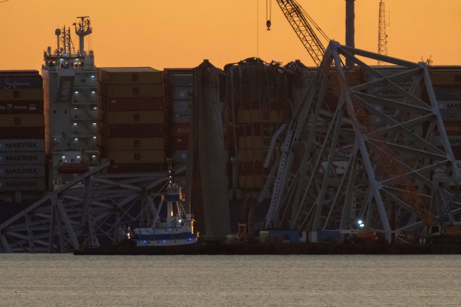 Baltimore Key bridge clean-up begins as authorities call off recovery efforts for missing bodies
