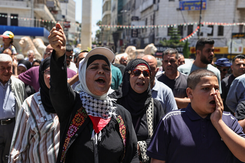 People chant slogans as they protest in support of Palestinians in Israeli jails in Ramallah in the occupied West Bank on June 11, 2024.