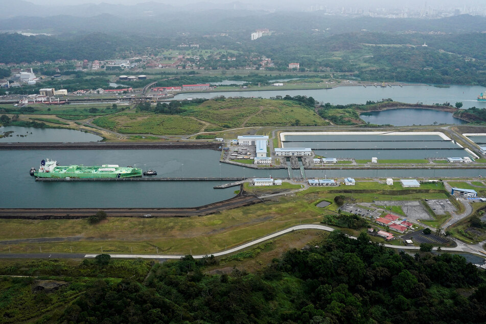 An aerial image shows a cargo vessel transiting through the Agua Clara Locks at the Panama Canal in Colon.