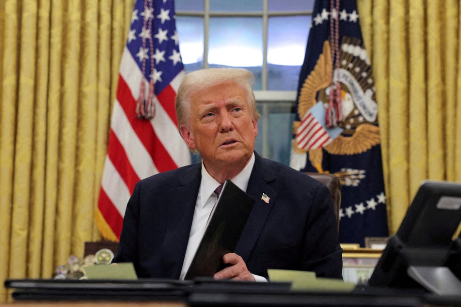 President Donald Trump issues executive orders and pardons in the Oval Office on his first day back at the White House.
