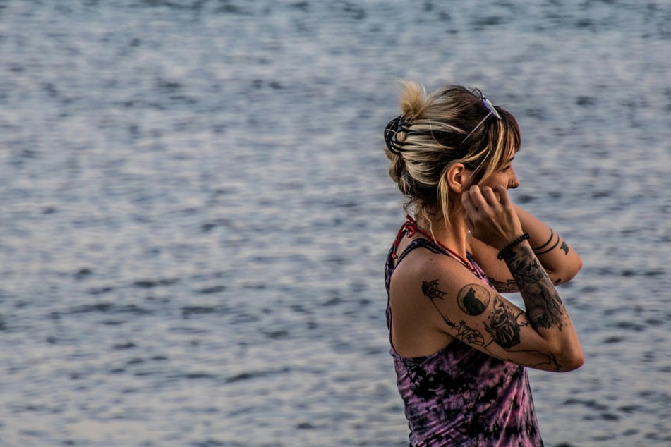 Marine biologist scores wild aquatic-themed world record for crazy tattoo journey